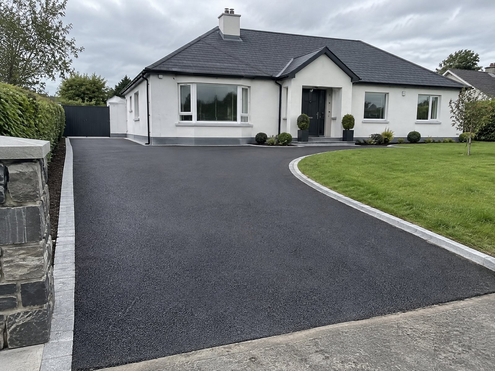 Tarmac driveway leading to an Irish bungalow