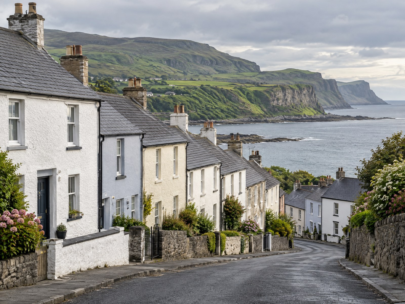 Coastal village street of rendered terraced houses on the Antrim coast
