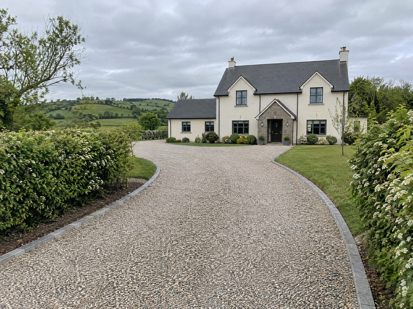 Gravel driveway with kerb edging at a Northern Irish farmhouse