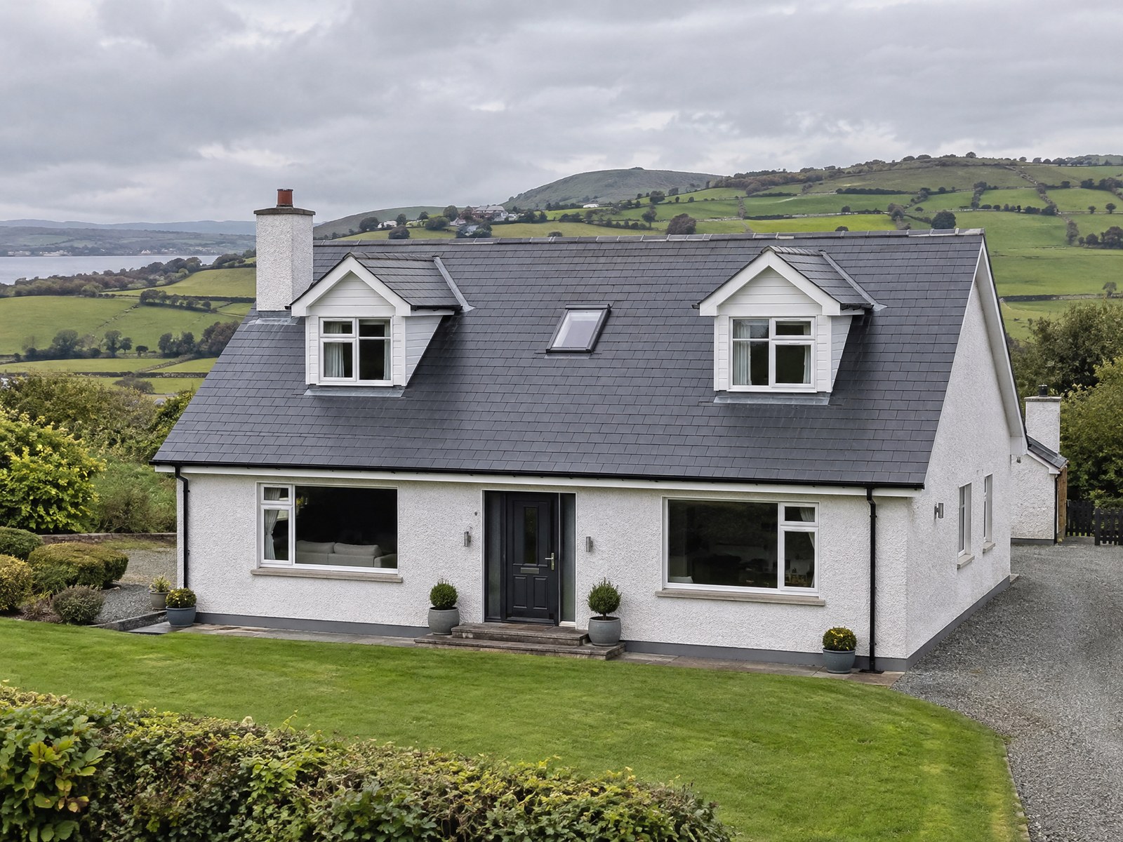 New slate roof on a pebble-dash dormer bungalow in County Antrim